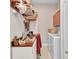 A functional laundry area featuring a washer, dryer, desk, and storage space at 1751 Nottingham Trl, Punta Gorda, FL 33980