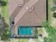 An aerial view of a pool, roof and backyard at 18396 Laramie Ave, Port Charlotte, FL 33954