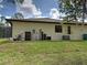 Exterior of the property featuring a well-maintained lawn at 18396 Laramie Ave, Port Charlotte, FL 33954