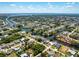 Wide aerial view of a waterfront community with many canals homes and open water views at 18584 Alphonse Cir, Port Charlotte, FL 33948