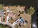 Aerial view of the property with a focus on the lot lines and backyard canal access at 18584 Alphonse Cir, Port Charlotte, FL 33948