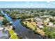 Scenic aerial view of a waterfront community with homes on canals and boat docks at 18584 Alphonse Cir, Port Charlotte, FL 33948