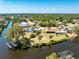 Expansive aerial view of a residential neighborhood with canal-front properties at 18584 Alphonse Cir, Port Charlotte, FL 33948