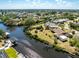 Aerial view of a coastal home with boat dock and waterfront access at 18584 Alphonse Cir, Port Charlotte, FL 33948