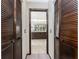 Bathroom featuring dual vanities and closet behind open louvered doors at 18584 Alphonse Cir, Port Charlotte, FL 33948