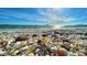 Beautiful beach with seashells, ocean views, and clear blue skies, creating a serene coastal scene at 18584 Alphonse Cir, Port Charlotte, FL 33948