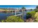 A boat lift on the canal, promoting convenient boating and waterside living in a picturesque setting at 18584 Alphonse Cir, Port Charlotte, FL 33948