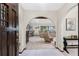 Open foyer featuring arched doorways, tiled flooring, and a view into the living room at 18584 Alphonse Cir, Port Charlotte, FL 33948