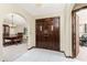 Foyer featuring decorative wood double doors and views of the dining room and office at 18584 Alphonse Cir, Port Charlotte, FL 33948