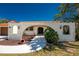 Inviting front entrance with decorative archway and manicured landscaping at 18584 Alphonse Cir, Port Charlotte, FL 33948