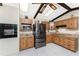 Kitchen showcases wood cabinets, granite countertops, stainless-steel appliances, and tiled flooring at 18584 Alphonse Cir, Port Charlotte, FL 33948