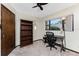Spare bedroom that has been converted to an office with desk and book shelves at 18584 Alphonse Cir, Port Charlotte, FL 33948