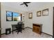 Office space with desk and filing cabinet beneath a window to the backyard at 18584 Alphonse Cir, Port Charlotte, FL 33948