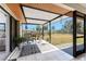 The covered patio has great seating and outdoor views at 18584 Alphonse Cir, Port Charlotte, FL 33948