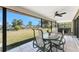 Screened patio features a fan, tile flooring, and gorgeous backyard views at 18584 Alphonse Cir, Port Charlotte, FL 33948