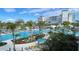 Stunning resort pool with lounge chairs, umbrellas, and lush tropical landscaping at 18584 Alphonse Cir, Port Charlotte, FL 33948
