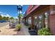 A vibrant outdoor patio dining at local restaurant, complete with lush plants and charming street views at 18584 Alphonse Cir, Port Charlotte, FL 33948