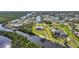 Aerial view showing the backyard and surrounding landscape on a waterfront property at 19023 Midway Blvd, Port Charlotte, FL 33948