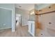 A bathroom with a walk-in shower featuring tan tile work at 19023 Midway Blvd, Port Charlotte, FL 33948