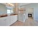 Bathroom featuring double sinks, white cabinets, a glass enclosed shower, and tile flooring at 19023 Midway Blvd, Port Charlotte, FL 33948