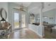 Welcoming foyer with decorative tile, beautiful lighting, and a glimpse into the game room at 19023 Midway Blvd, Port Charlotte, FL 33948