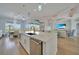 Bright, open-concept kitchen with island seating and a seamless transition to the living space at 19023 Midway Blvd, Port Charlotte, FL 33948