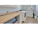 Well-equipped laundry room with modern washer, dryer, ample counter space, and natural light from a nearby window at 19023 Midway Blvd, Port Charlotte, FL 33948