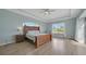 Spacious main bedroom with large windows, natural light, and wood-look tile flooring at 19023 Midway Blvd, Port Charlotte, FL 33948