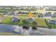 Expansive aerial view of a home in a waterfront community with lush greenery and beautiful water views at 235 Tournament Rd, Rotonda West, FL 33947