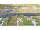 A beautiful aerial view of a neighborhood featuring waterfront homes and canals with many homes having private pools at 235 Tournament Rd, Rotonda West, FL 33947