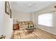 Cozy living room features wood flooring, a neutral color palette, and plenty of natural light at 235 Tournament Rd, Rotonda West, FL 33947