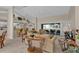 Bright living room features high ceilings and an open floor plan with access to an outdoor space at 235 Tournament Rd, Rotonda West, FL 33947