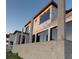 New home construction showing modern architectural details, large windows and concrete block structure at 242 Bangsberg Se Rd, Port Charlotte, FL 33952