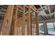 Interior framing showcasing the structure and design of a home with expansive windows overlooking the water at 242 Bangsberg Se Rd, Port Charlotte, FL 33952