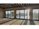 Modern living room framing showcases waterfront views through expansive windows and sliding doors at 242 Bangsberg Se Rd, Port Charlotte, FL 33952