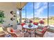Relax on the screened-in lanai, featuring brick pavers, a ceiling fan and views of the golf course at 24260 Westgate Blvd, Port Charlotte, FL 33980