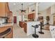 Spacious open floorplan featuring a kitchen with island and bar seating flowing into the living area at 24260 Westgate Blvd, Port Charlotte, FL 33980