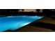 Inviting pool lit at night providing a calming and ambient atmosphere at 24260 Westgate Blvd, Port Charlotte, FL 33980