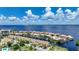 Waterfront community showcasing docks and colorful buildings near the bay at 25188 Marion Ave # 1033, Punta Gorda, FL 33950