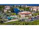 Wide overhead community view near the bay featuring tennis courts and a pool at 25188 Marion Ave # 1033, Punta Gorda, FL 33950