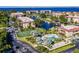 Aerial view of the community pool, tennis courts, and harbor at 25188 Marion Ave # 1033, Punta Gorda, FL 33950