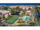 An aerial view of the community featuring tennis courts and a pool at 25188 Marion Ave # 1033, Punta Gorda, FL 33950