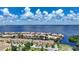 Overhead community view near the bay with lush trees and colorful buildings at 25188 Marion Ave # 1033, Punta Gorda, FL 33950