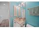 Bright bathroom featuring a shell-shaped sink, and neutral-colored vanity at 25188 Marion Ave # 1033, Punta Gorda, FL 33950