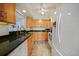 Bright kitchen with stainless steel appliances, granite countertops, and ample cabinet space at 25188 Marion Ave # 1033, Punta Gorda, FL 33950