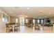 Well-lit dining area featuring elegant tables, chairs, and decorative light fixtures, perfect for community gatherings at 25340 E Lenox Cir, Punta Gorda, FL 33950