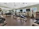 Well-equipped community gym featuring treadmills, weights, and other fitness equipment with mirrored walls at 25340 E Lenox Cir, Punta Gorda, FL 33950
