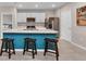 Bright kitchen featuring an island with seating and stainless steel appliances, perfect for entertaining at 25340 E Lenox Cir, Punta Gorda, FL 33950