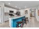 Bright kitchen featuring an island with seating and stainless steel appliances, perfect for entertaining at 25340 E Lenox Cir, Punta Gorda, FL 33950