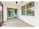 Screened in patio includes ceiling fan and sliding glass door to backyard at 25340 E Lenox Cir, Punta Gorda, FL 33950